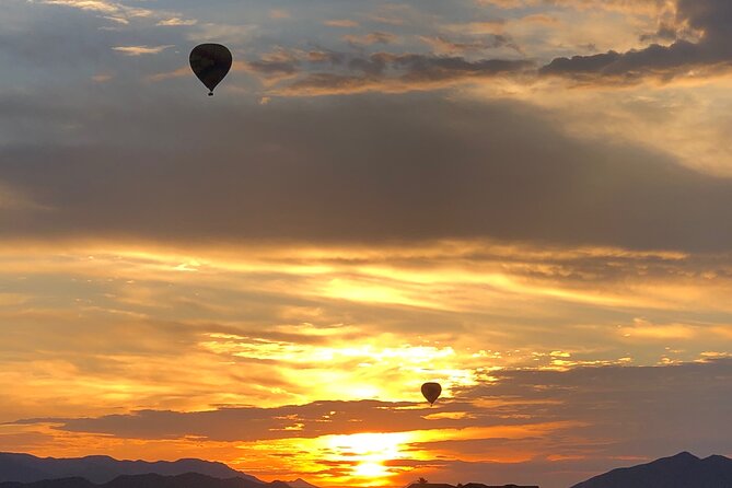 Sunrise Sonoran Desert Hot Air Balloon Ride from Phoenix - Camelback Mountain at altitude: strong silhouettes and classic Phoenix photos